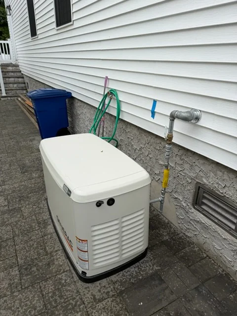 Standby generator beside a house